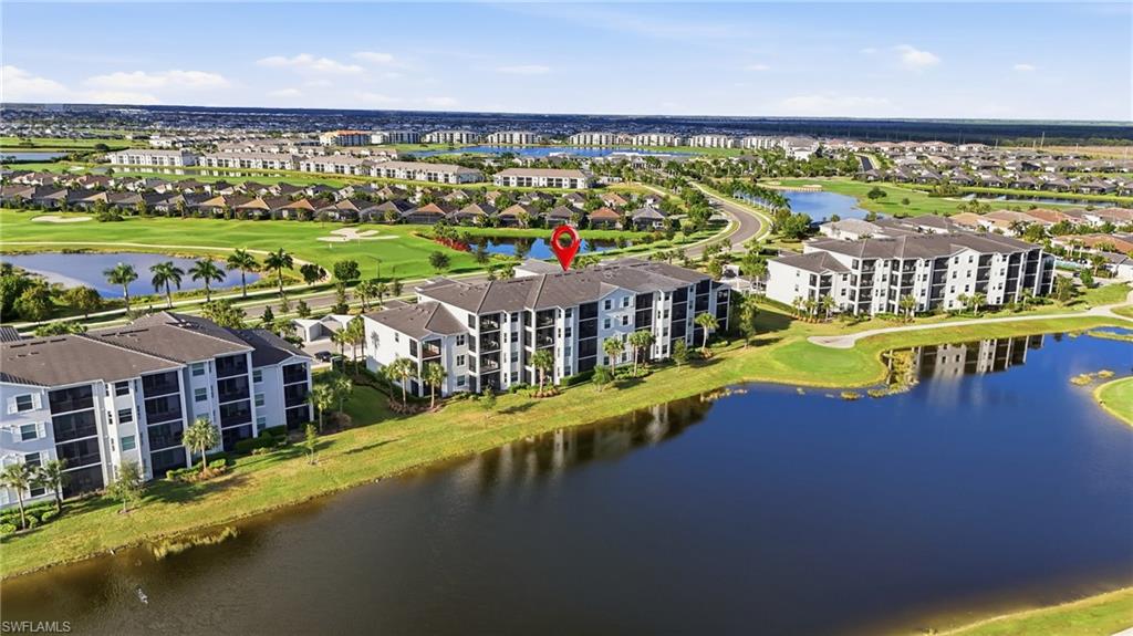 6046 National Boulevard, Unit 446 Immokalee, FL 34142 - Photo 22 of 50 a view of a swimming pool and an outdoor seating