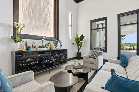 a front view of a house with a yard table and chairs