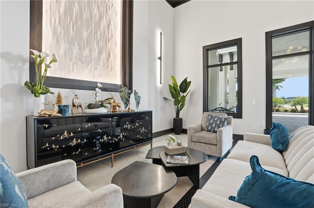 6046 National Boulevard, Unit 446 Immokalee, FL 34142 - Photo 25 of 50 a living room with furniture and a large window