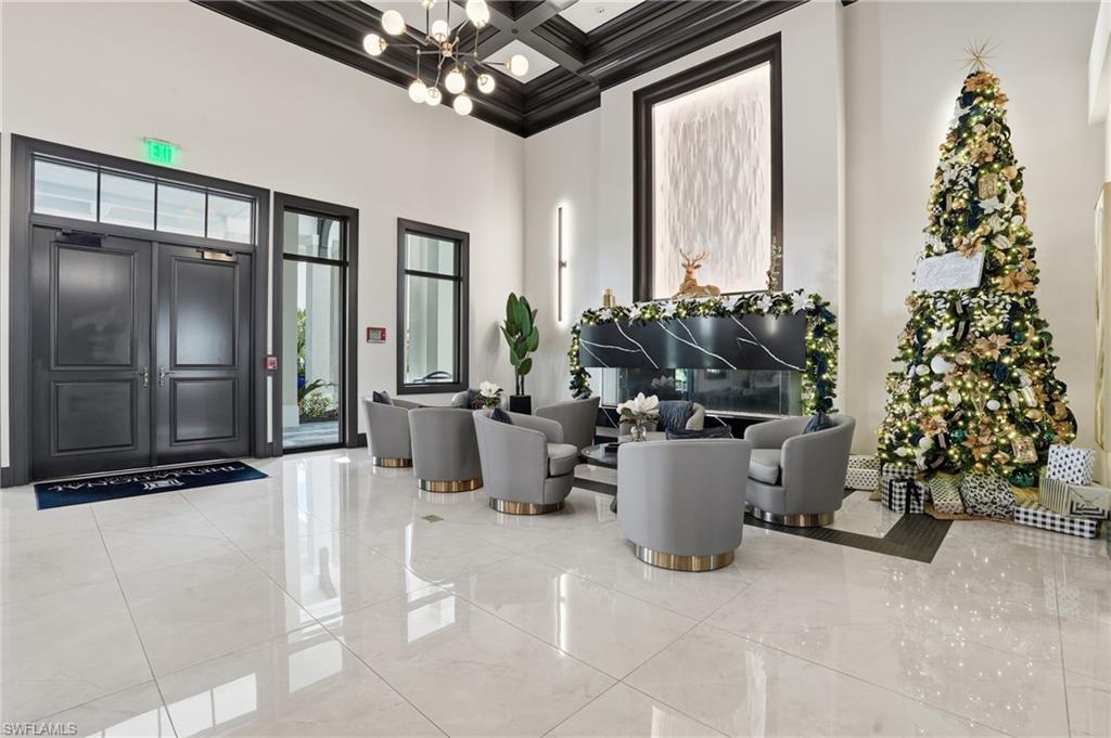 6046 National Boulevard, Unit 446 Immokalee, FL 34142 - Photo 26 of 50 a living room with furniture and a potted plant