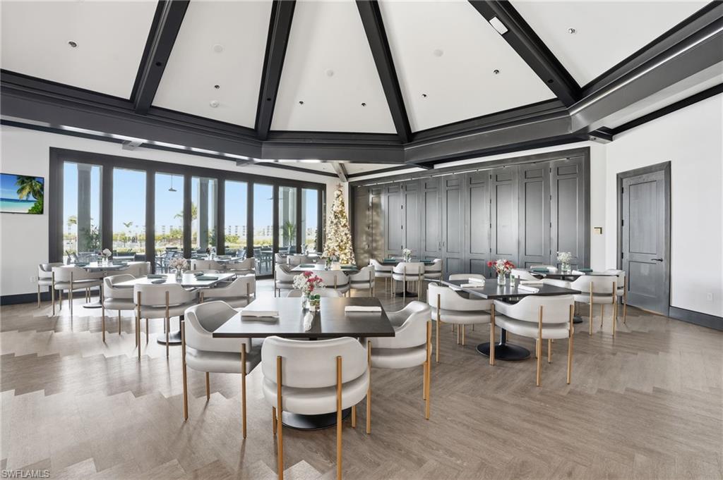 6046 National Boulevard, Unit 446 Immokalee, FL 34142 - Photo 30 of 50 a living room with lots of furniture and a large window