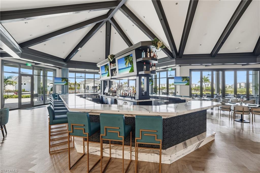 6046 National Boulevard, Unit 446 Immokalee, FL 34142 - Photo 49 of 50 a view of a dining room with furniture window and wooden floor