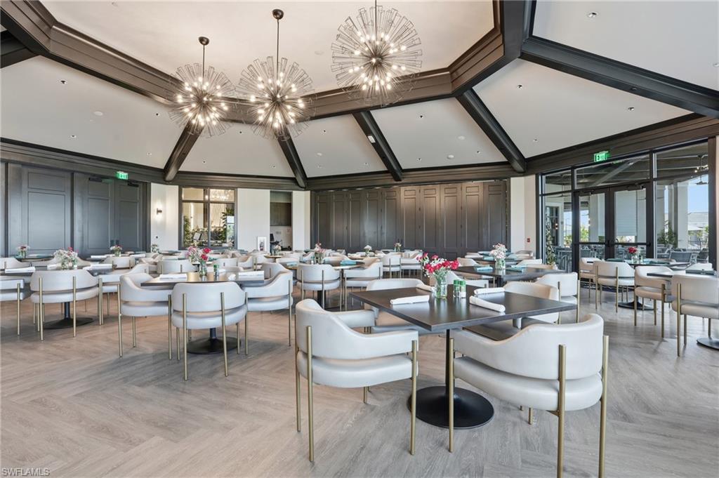 6046 National Boulevard, Unit 446 Immokalee, FL 34142 - Photo 32 of 50 a group of people sitting in a living room