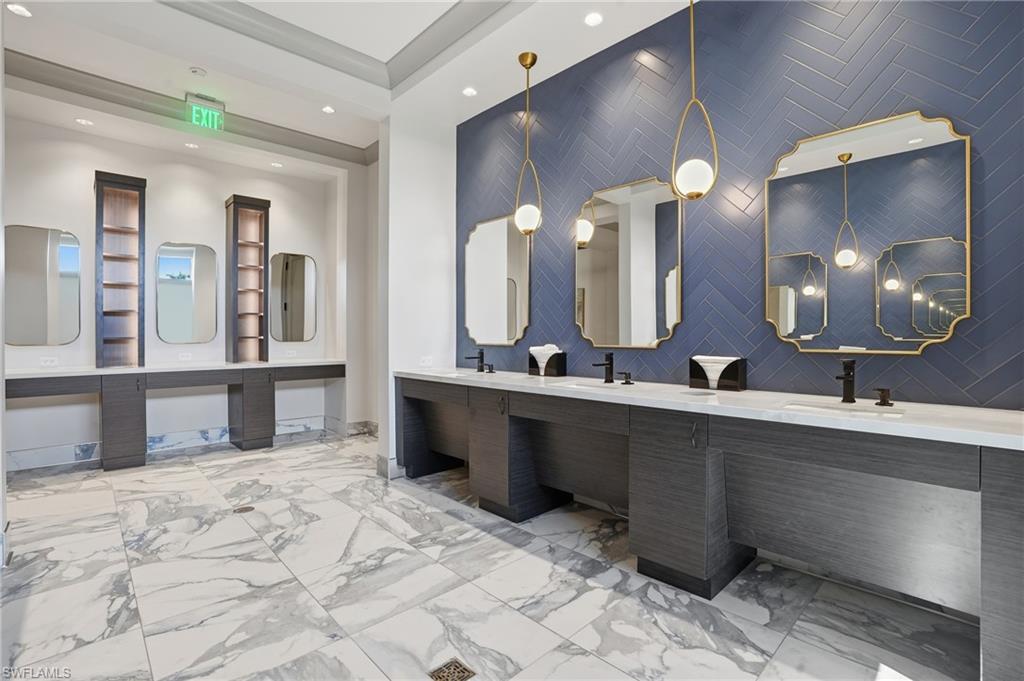 6046 National Boulevard, Unit 446 Immokalee, FL 34142 - Photo 34 of 50 a large bathroom with a large tub and sink