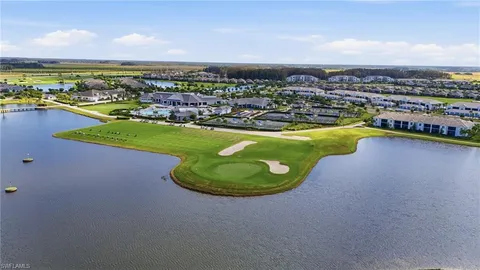 an aerial view of a house with a ocean view