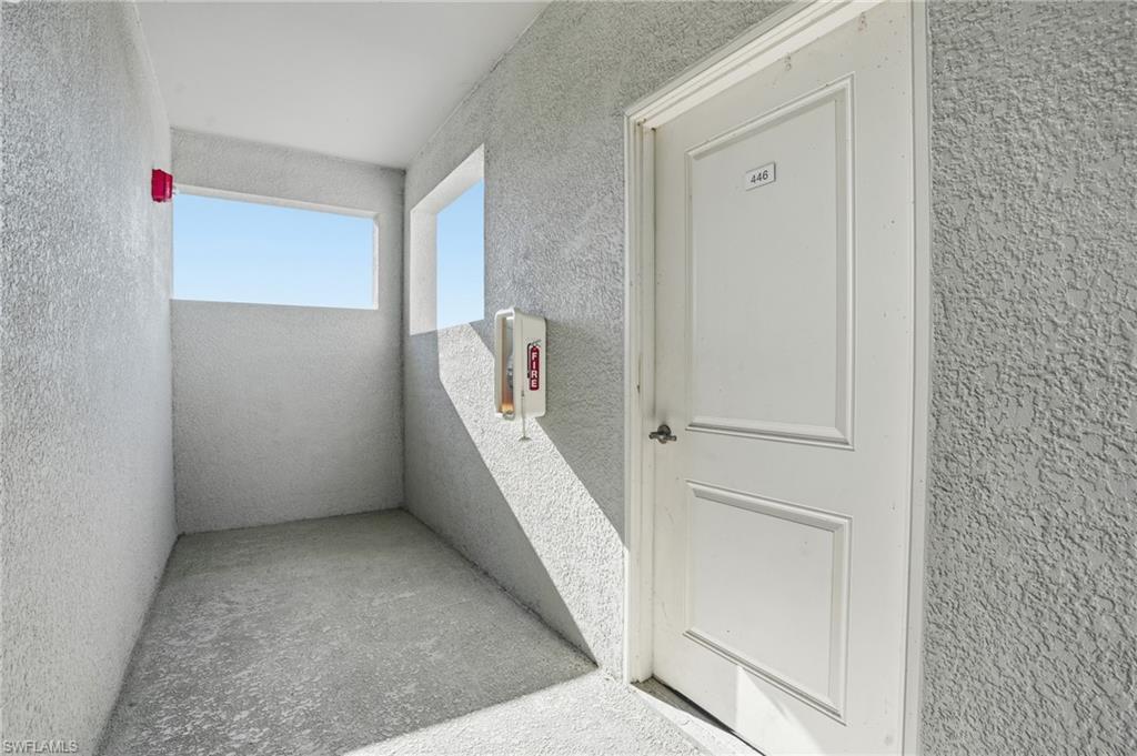 6046 National Boulevard, Unit 446 Immokalee, FL 34142 - Photo 46 of 50 an entryway with a white walls