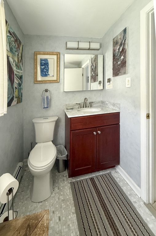 26 Merrill Road, Unit 26 Hull, MA 02045 - Photo 23 of 24 a bathroom with a toilet sink and mirror
