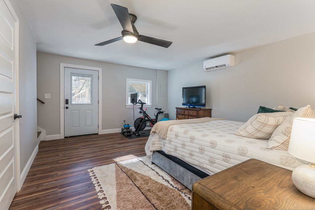 45 Mountain Stream Road Murphy, NC 28906 - Photo 28 of 42 a bedroom with a bed and a tv