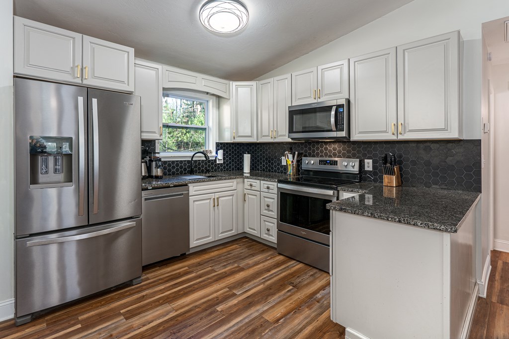 45 Mountain Stream Road Murphy, NC 28906 - Photo 10 of 42 a kitchen with stainless steel appliances granite countertop a refrigerator sink and microwave