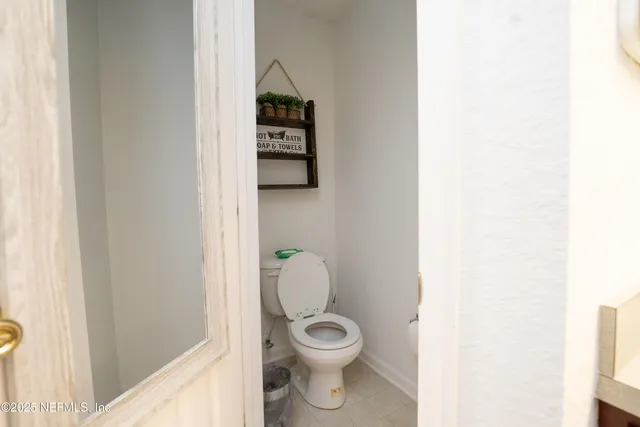 a bedroom with a bed and cabinets