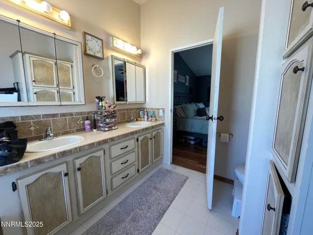 a bed room with a bed and a television