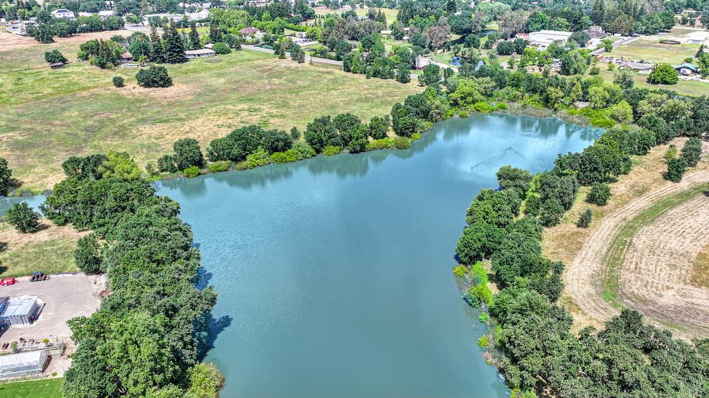 10500 Wilton Road Elk Grove, CA 95624 - Photo 22 of 31 an aerial view of residential house with outdoor space and lake view
