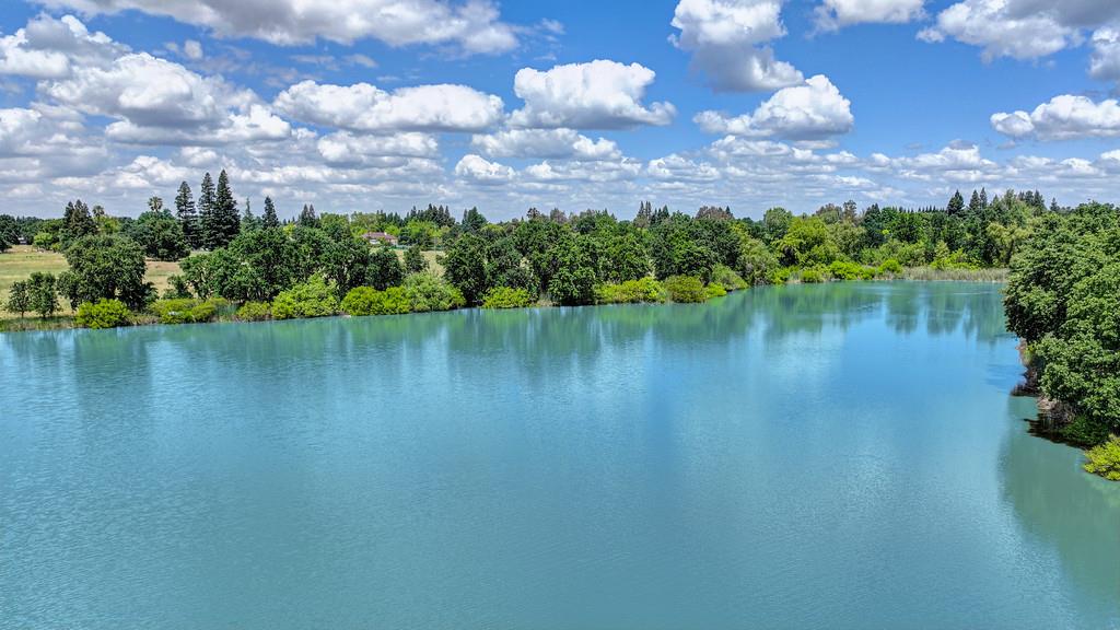 10500 Wilton Road Elk Grove, CA 95624 - Photo 24 of 31 a view of a lake with houses in the background