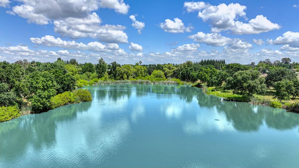 10500 Wilton Road Elk Grove, CA 95624 - Photo 25 of 31 a view of a lake in middle of forest