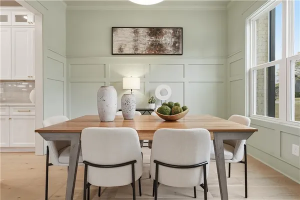 a dining room with furniture and window
