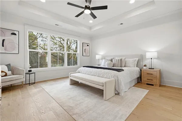 a bedroom with a large bed and a window