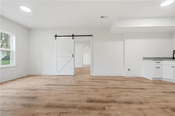 a view of an empty room with a window