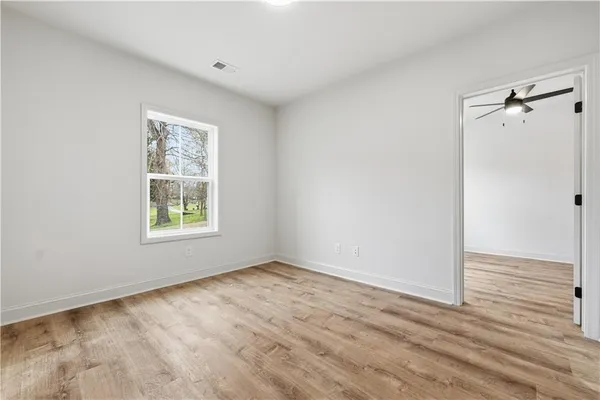 a view of an empty room with a window