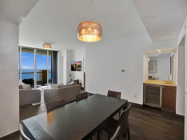 a view of a dining room with furniture window and wooden floor