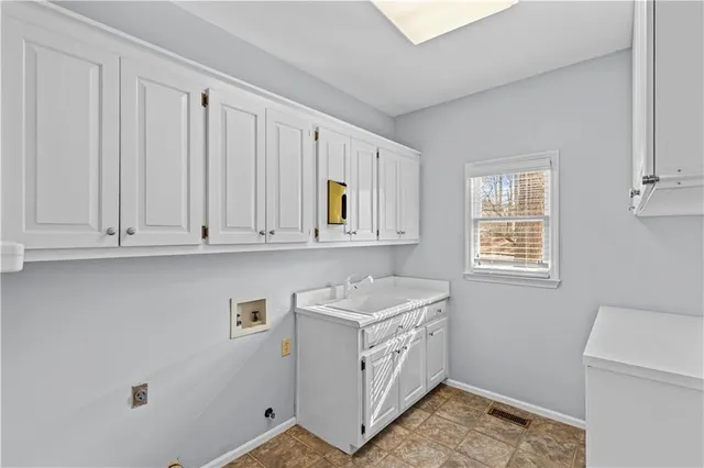 a utility room with closet dryer and washer