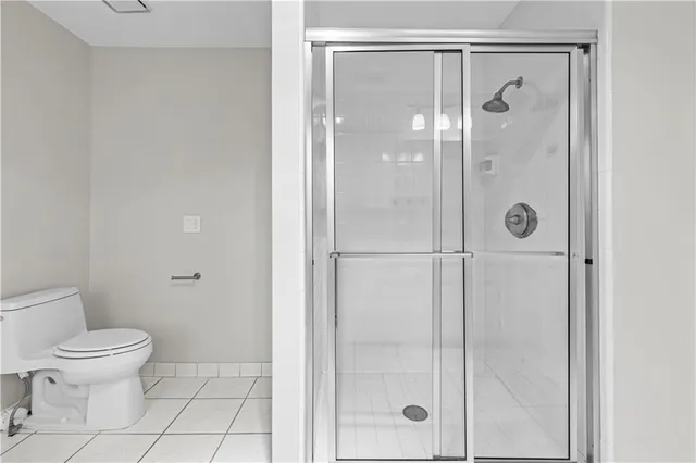 a bathroom with a glass shower door
