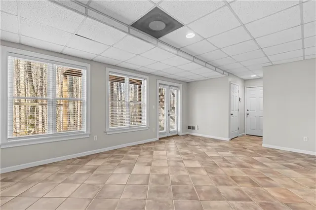 a view of an empty room with windows