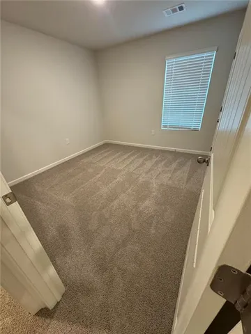 an entryway door with a hallway