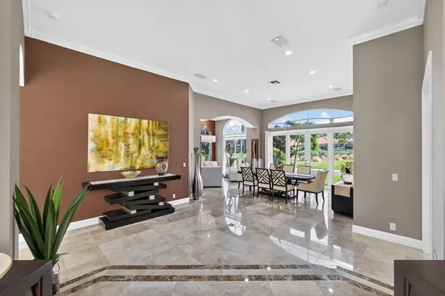 a view of a swimming pool with a patio and a garden