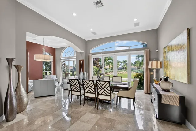 an aerial view of a house with a garden and swimming pool