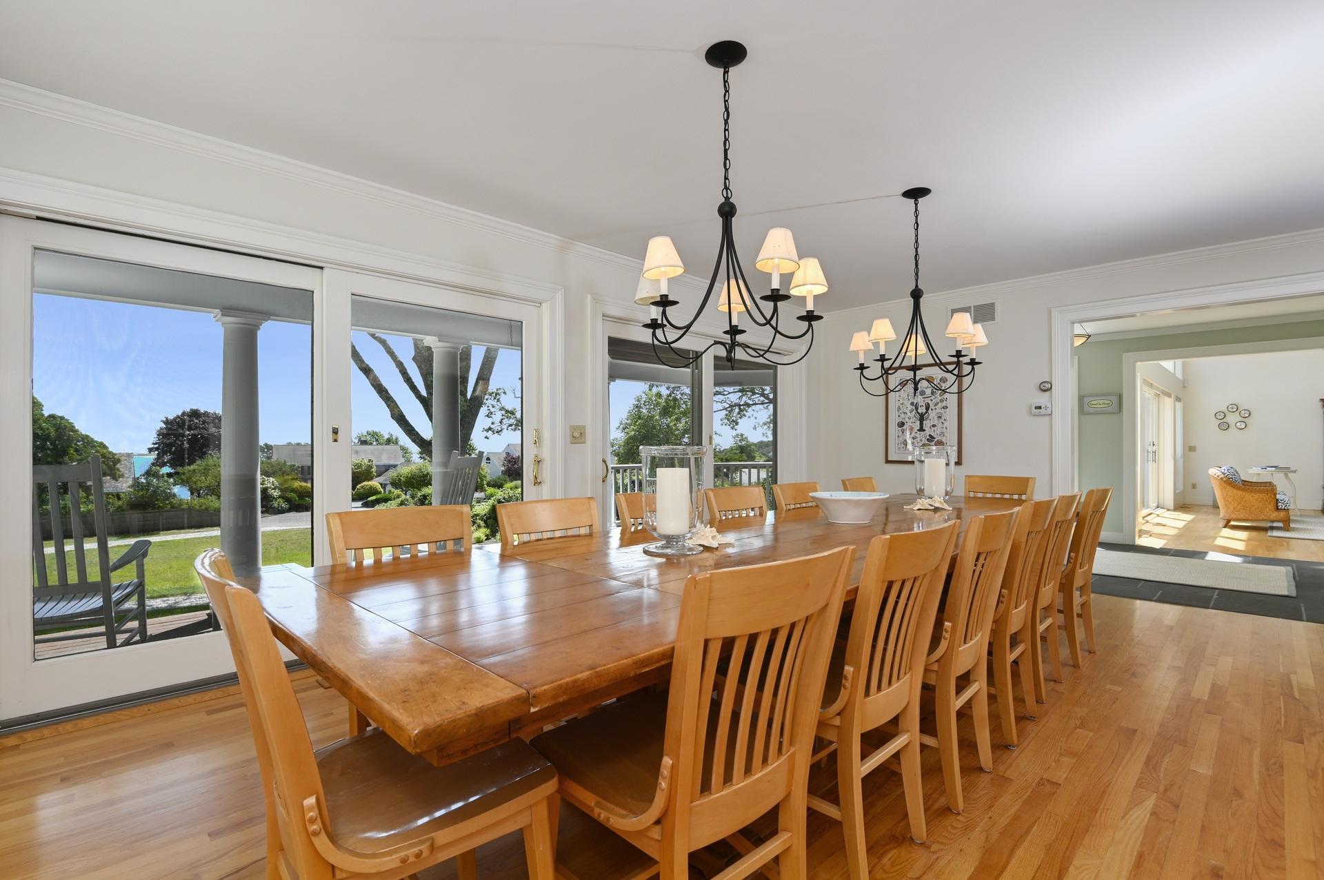 22 Little Bay Road Orleans, MA 02653 - Photo 13 of 39 a view of a dining room and livingroom with furniture wooden floor a chandelier
