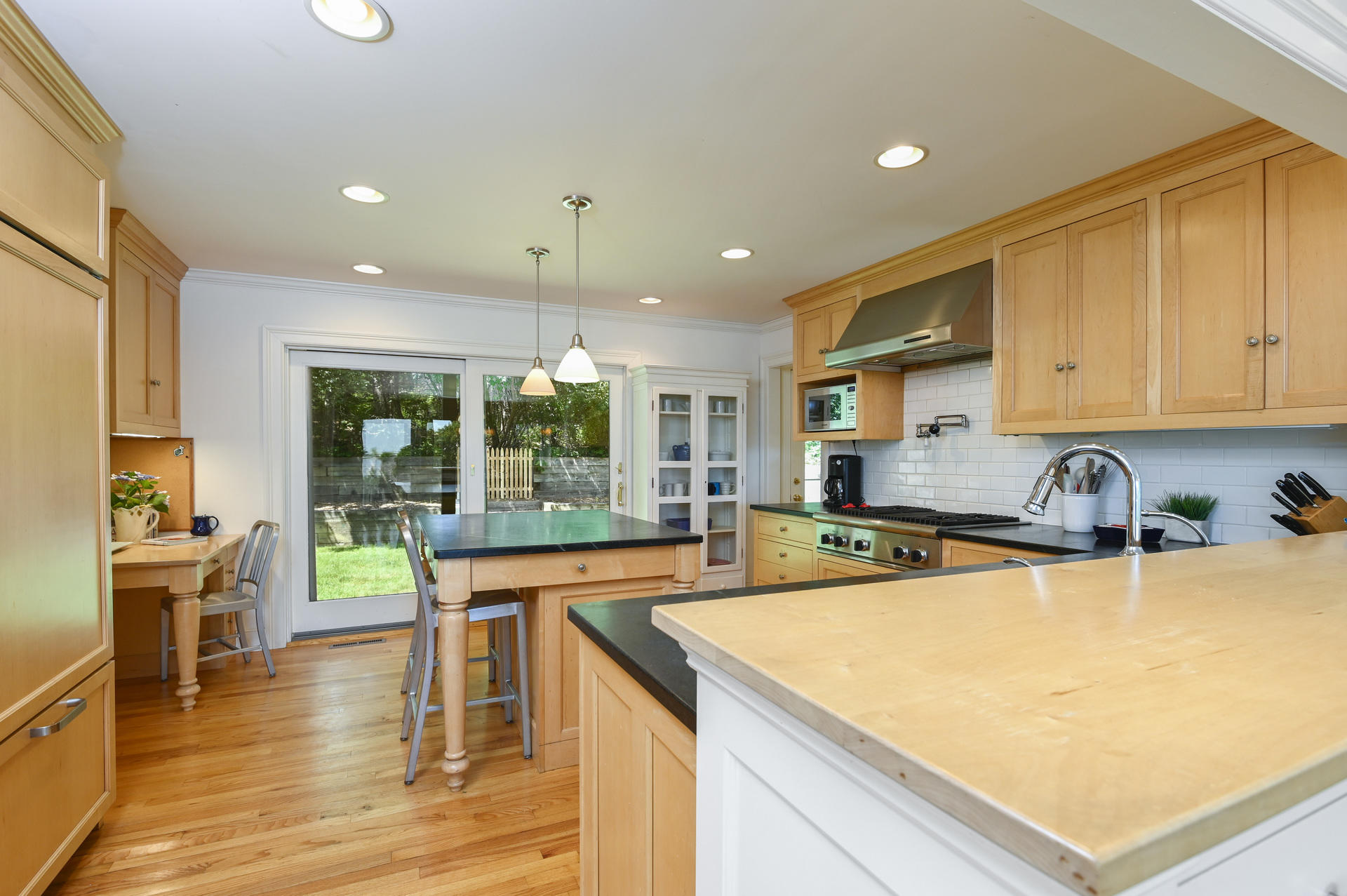 22 Little Bay Road Orleans, MA 02653 - Photo 14 of 39 a kitchen with stainless steel appliances granite countertop a sink and cabinets