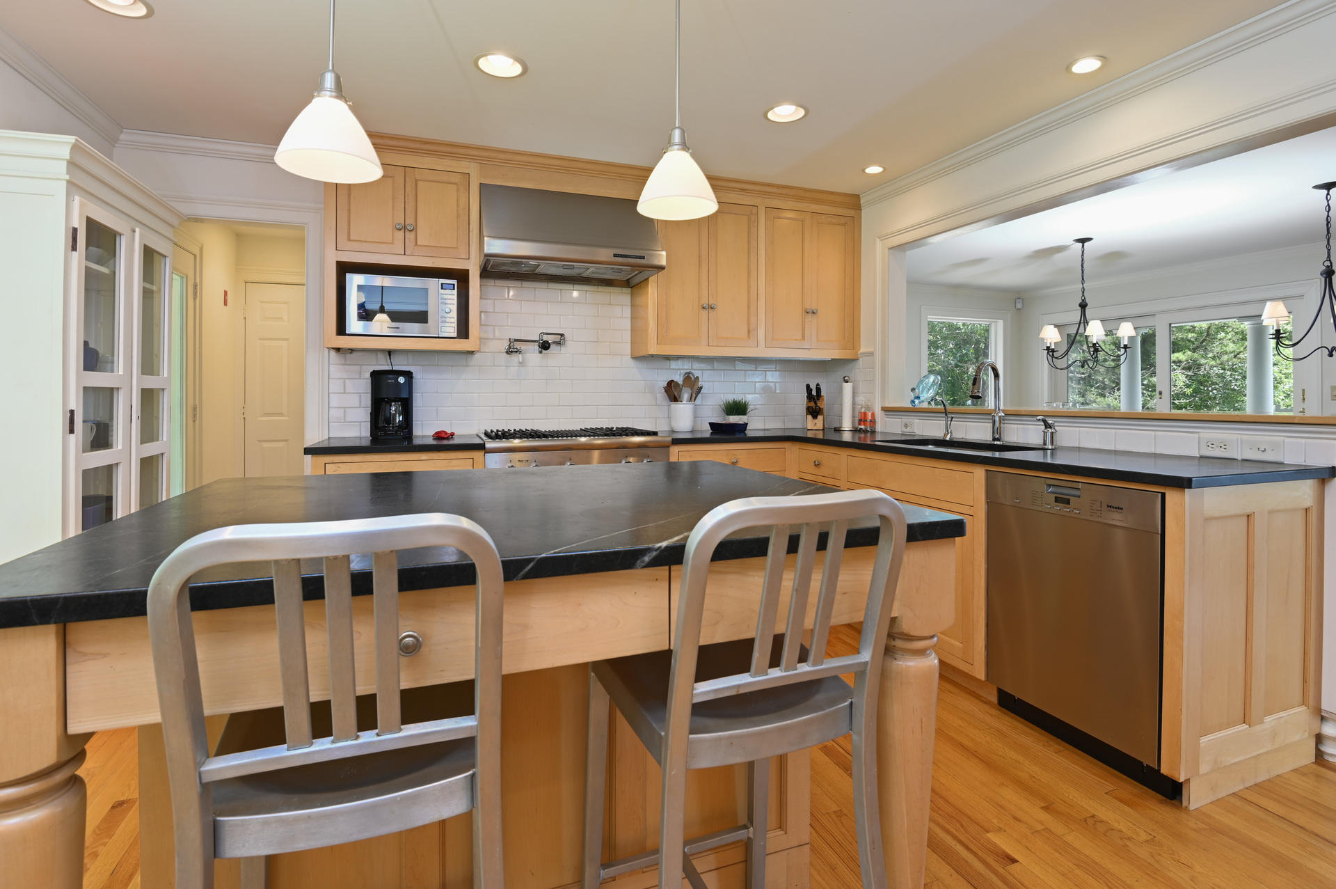 22 Little Bay Road Orleans, MA 02653 - Photo 16 of 39 a kitchen with a sink a counter space cabinets and appliances