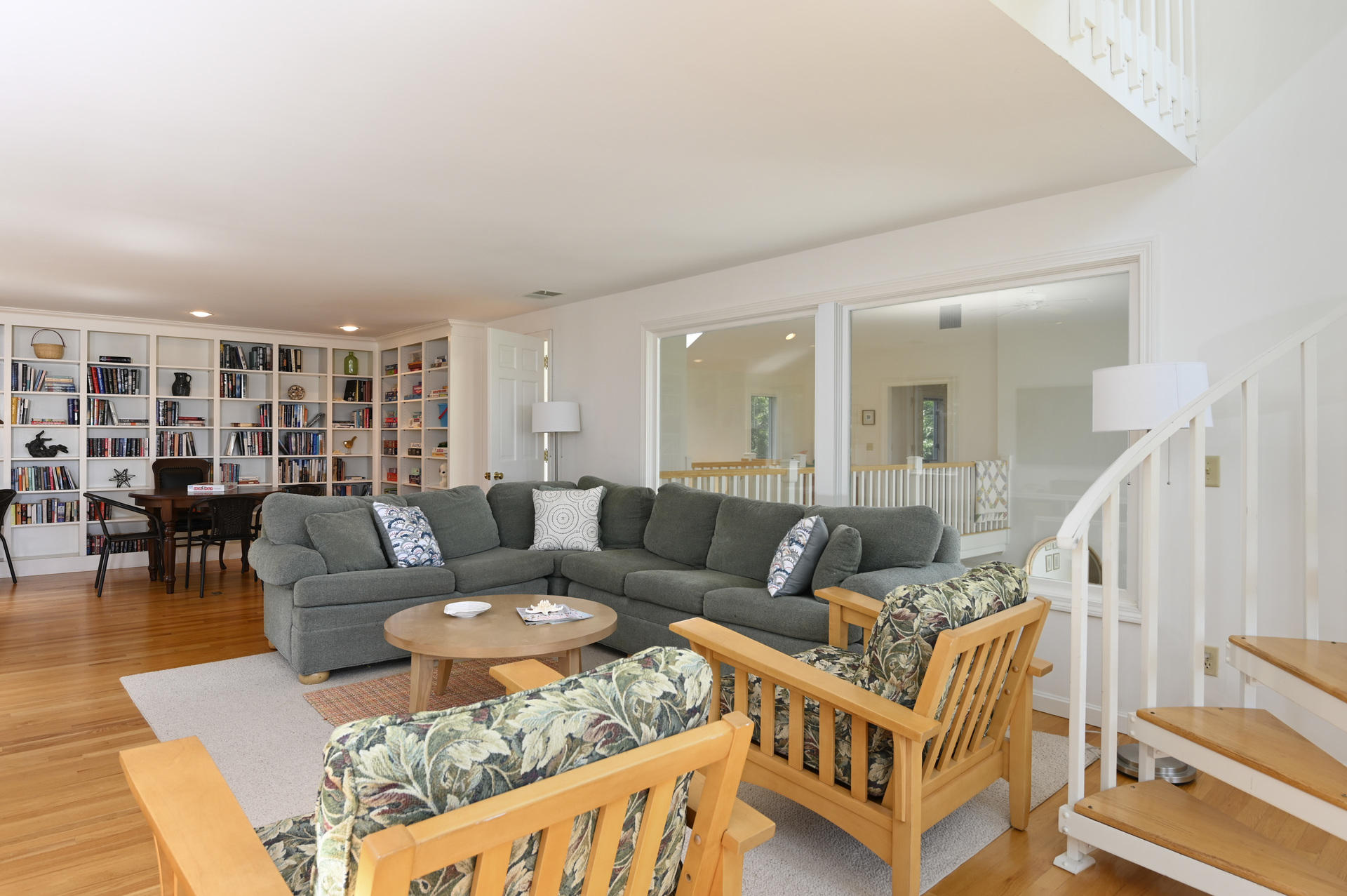 22 Little Bay Road Orleans, MA 02653 - Photo 21 of 39 a living room with furniture a wooden floor and next to a window