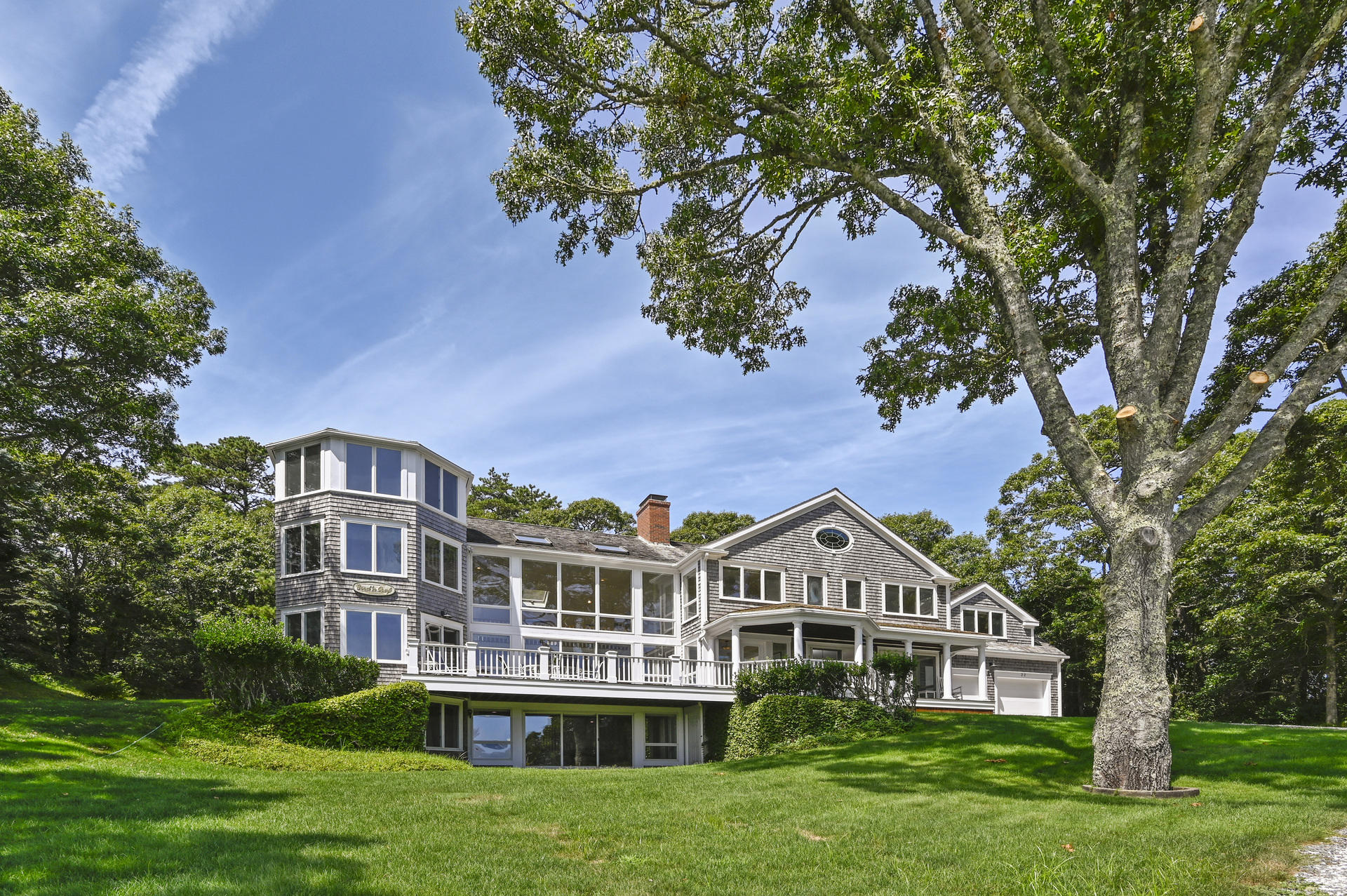 22 Little Bay Road Orleans, MA 02653 - Photo 3 of 39 a front view of a residential apartment building with a yard