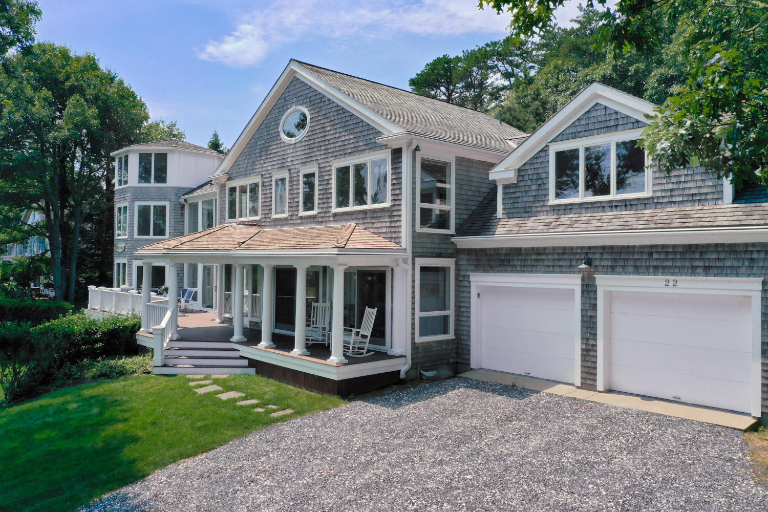 22 Little Bay Road Orleans, MA 02653 - Photo 31 of 39 a front view of a house with a garden and porch