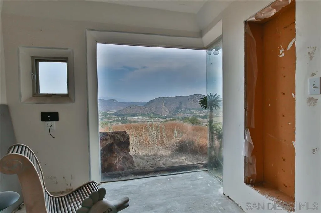 2908 Sumac Road Fallbrook, CA 92028 - Photo 17 of 23 a bathroom with a glass shower door