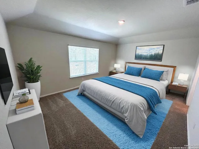 a bedroom with a bed and window