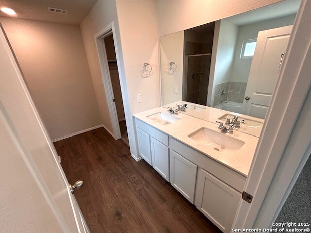 3815 Rusted Copper Bulverde, TX 78163 - Photo 17 of 36 a bathroom with a sink a mirror and a shower