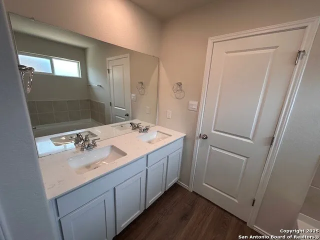 a bathroom with a sink and mirror