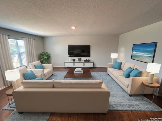 a living room with furniture and a flat screen tv