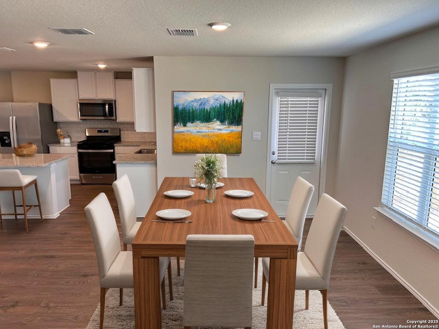 3815 Rusted Copper Bulverde, TX 78163 - Photo 5 of 36 a view of a dining room with furniture and a window