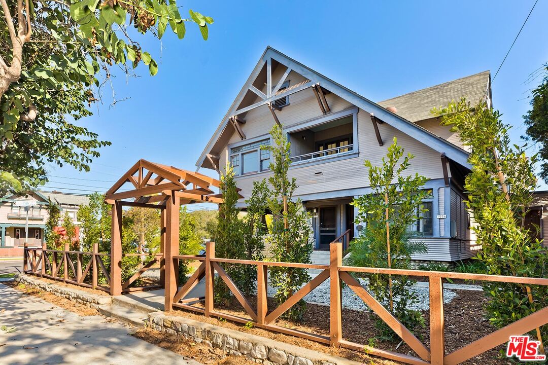 a front view of a house with wooden stairs