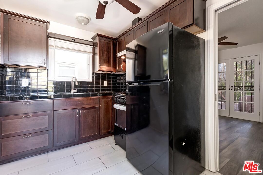 1054 Maine Avenue, Unit 3 Long Beach, CA 90813 - Photo 12 of 13 a kitchen with a refrigerator and a sink