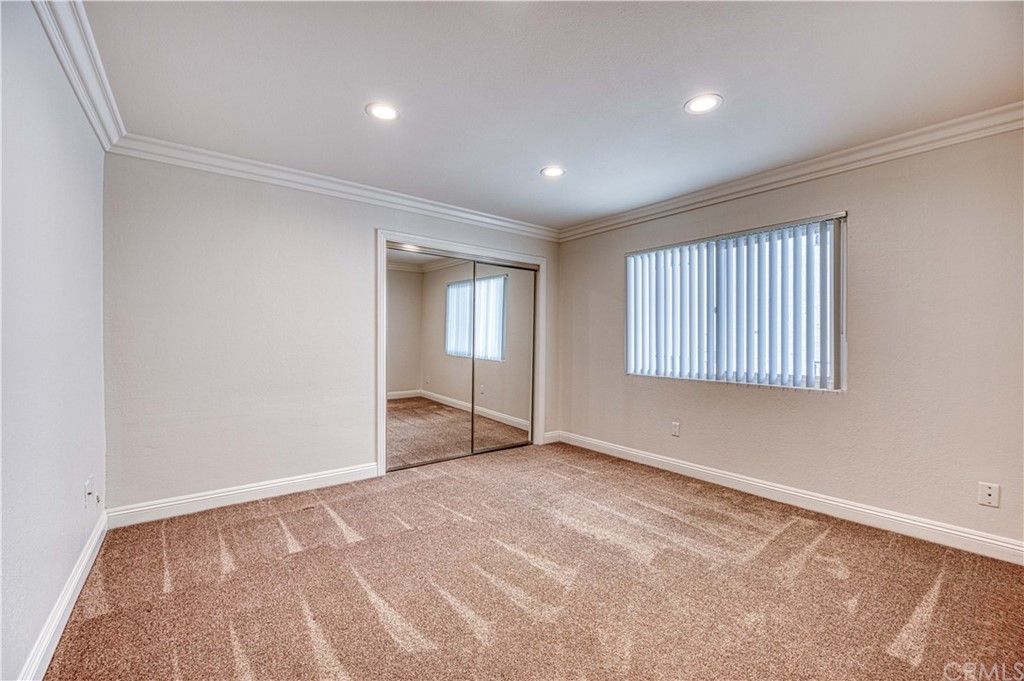 33782 Malaga Drive, Unit A Dana Point, CA 92629 - Photo 13 of 17 wooden floor in an empty room with a window