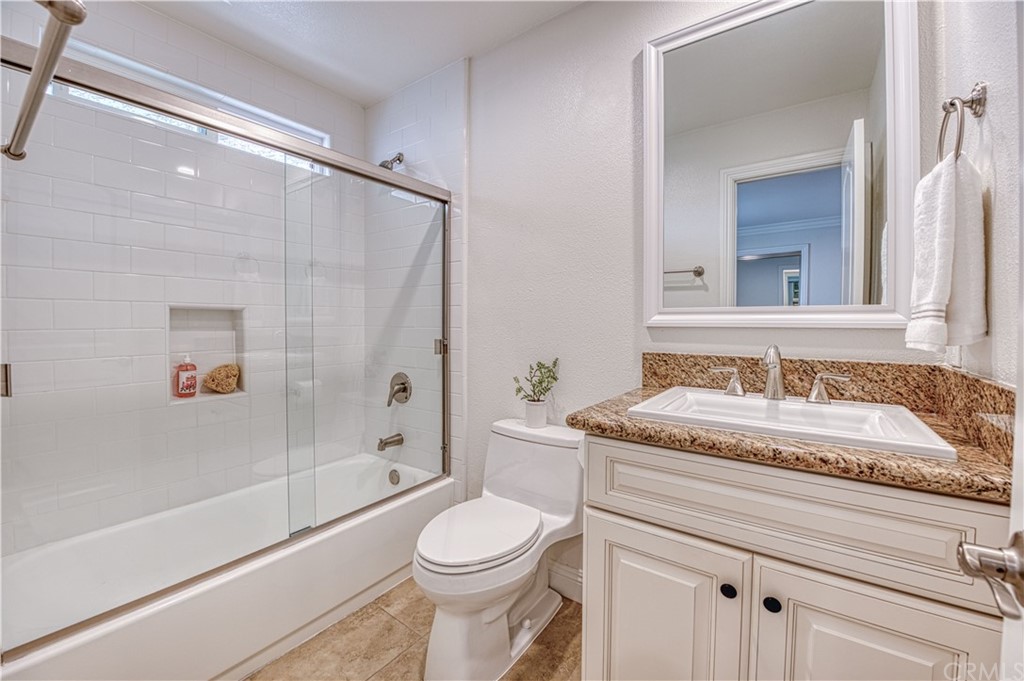 33782 Malaga Drive, Unit A Dana Point, CA 92629 - Photo 15 of 17 a bathroom with a granite countertop sink a toilet and shower