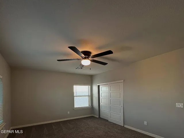 a view of cabinets and window