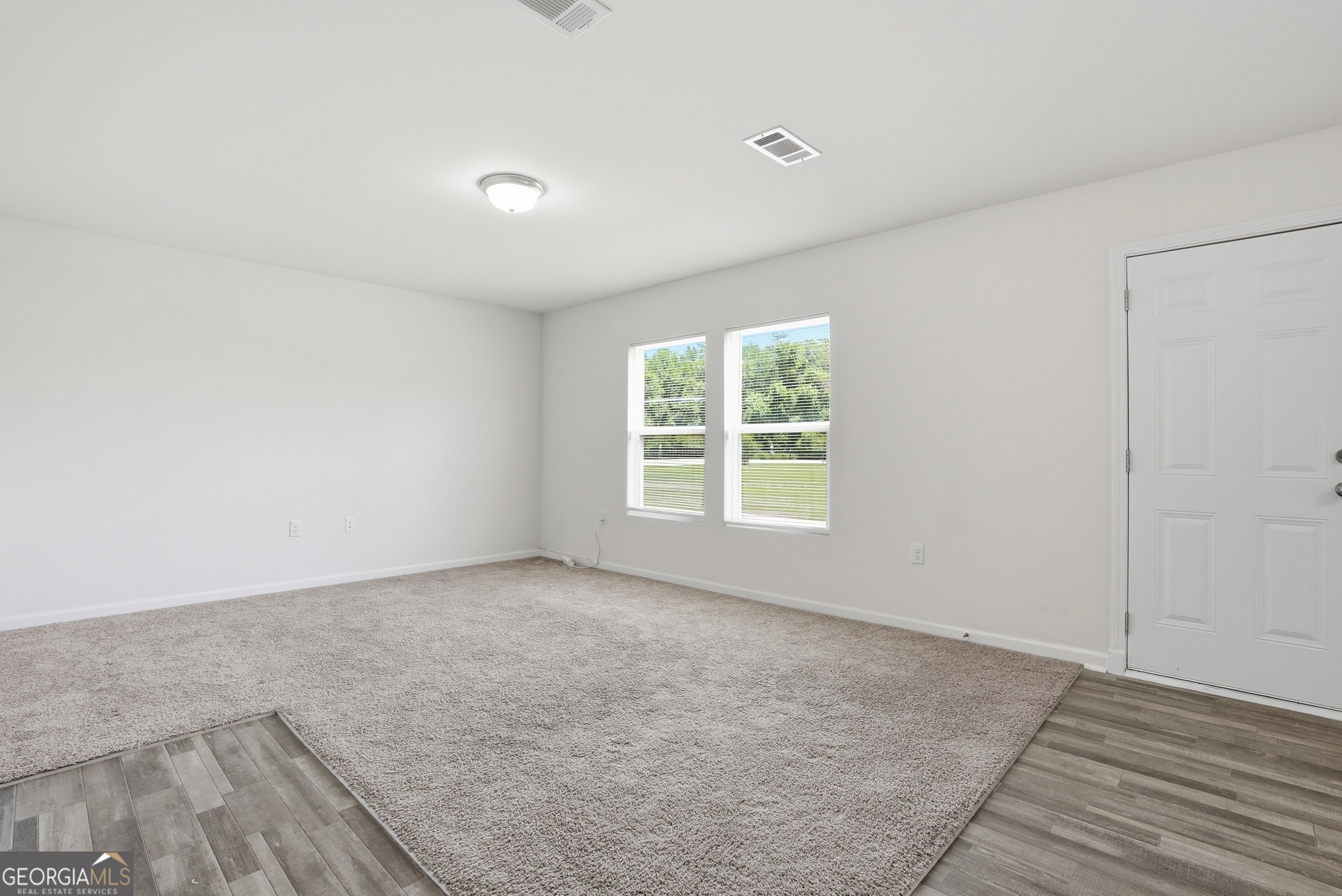 225 Rendell Lane Hinesville, GA 31313 - Photo 16 of 33 an empty room with windows