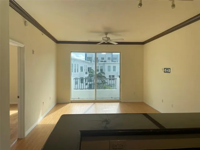 a view of outdoor space with wooden floor and windows