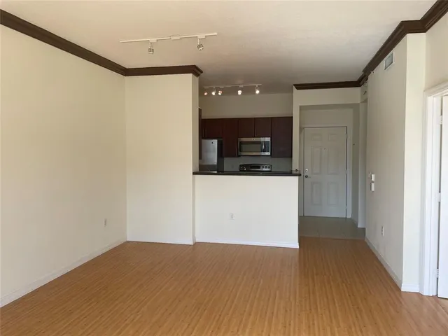 a view of a kitchen from the hallway
