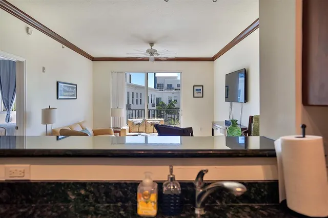 a view of a kitchen area with furniture and flat screen tv
